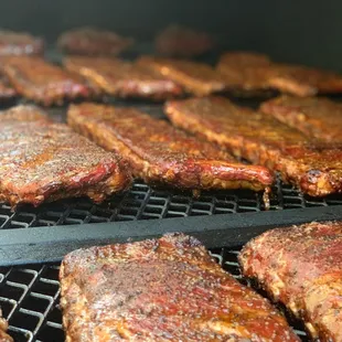 ribs cooking on a grill