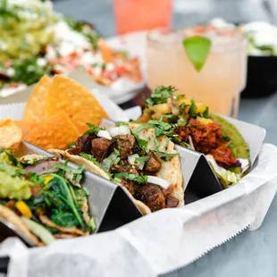 a tray of tacos and chips