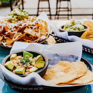 nachos, guacamole, and tortillas