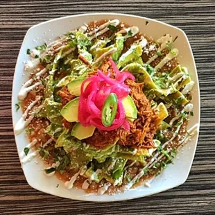 Chilaquiles Bomba ( Habanero Sour Cream and Cochinita Pibil )