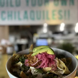 a person holding a bowl of food
