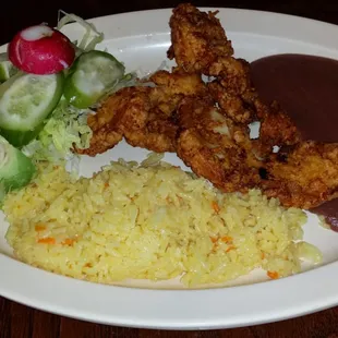 Pollo Empanizado (breaded chicken with beans, rice, and salad)