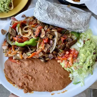 Lunch Fajita Vegana  with vegan sausage and double refried beans instead of rice.