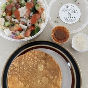 a plate of pancakes and a bowl of salad