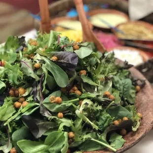 Ensalada de Temporada topped with crispy garbanzo beans