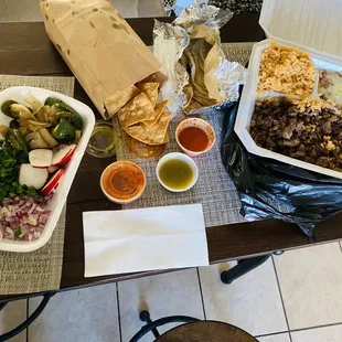Asada plate with jalapeño and onion and chips and extra tortillas and what else!? Yum