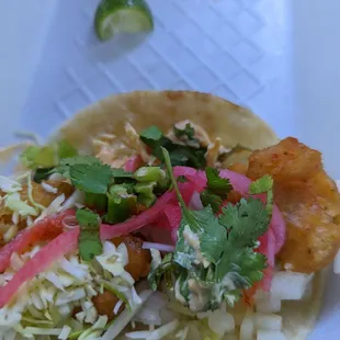 Dressed up my shrimp taco $2.80 at Salsa Bar, shredded cabbage, onions, picked onions, cilantro, jalapeno &amp; lime and chipotle mayo Mmmm