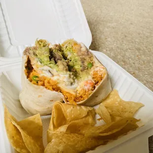 Carne Asada Burrito with Mexican rice and beans, sour cream, cheese, &amp; guacamole!