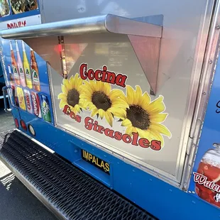 sunflowers on the side of a food truck