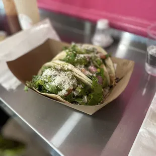 A. Three la Clasica Tacos con carnitas