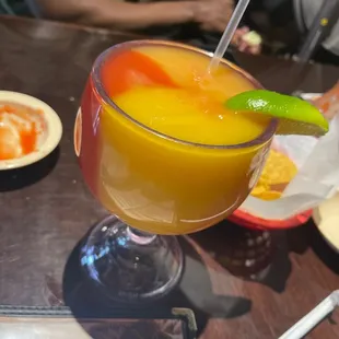 Peach, mango and strawberry frozen margarita