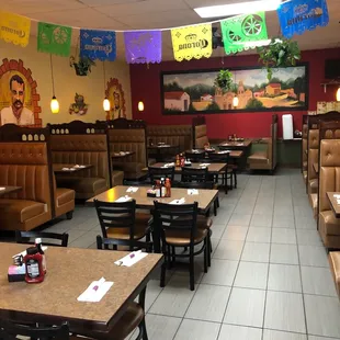 a mexican restaurant with tables and booths