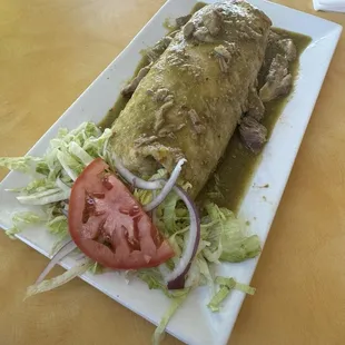 Pork salsa verde burrito plated for dine in service; excellent burrito!