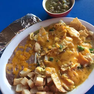 Breakfast of delicious green chilaquiles and a side of spicy chile verde con carne are a favorite way to start my day!