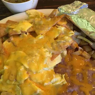 Awesome green chilaquiles with side of chile verde con carne! Spicy and addictive -- always freshly made!