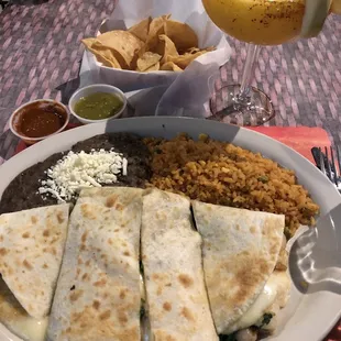 Huge quesadilla (good) and mango margarita (not good).