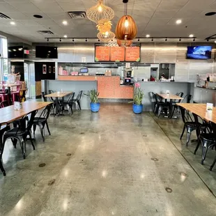 a restaurant with tables and chairs