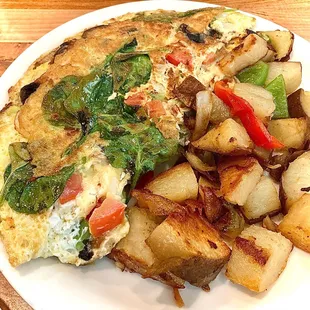 Veggie omelette w/ cottage potatoes side. Looked impressive, but be aware cheese is not included, comes empty inside.