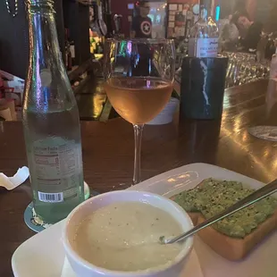 Avocado toast and gazpacho alongside Topochico &amp; Rosé