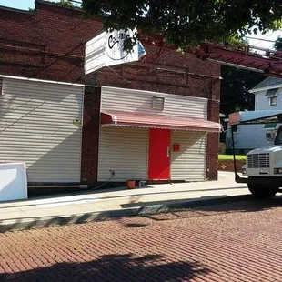 a man standing next to a truck