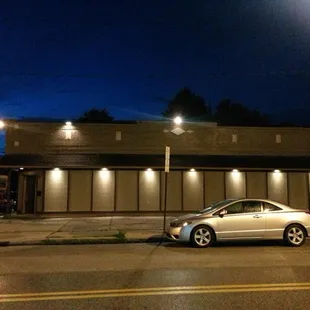 two cars parked in front of a restaurant