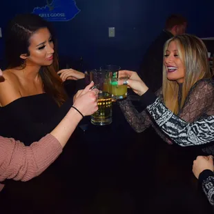 a group of women toasting at a party