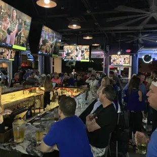 a crowd of people at a sports bar