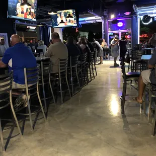 people sitting at the bar