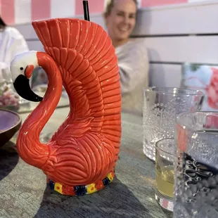 a pink flamingo on a table