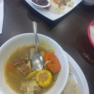 a bowl of soup with a spoon in it