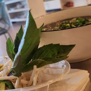 Beef Pho with bean sprouts/jalapeños a lime on the side
