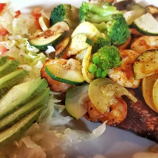 Tres Amigos Keto style with no beans and avocado salad. very tasty and filling with steak, chicken, steak, and broccoli and zucchini.