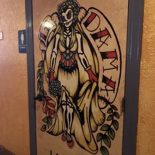 a door with a painting of a woman on it