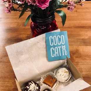 a box of chocolates and flowers