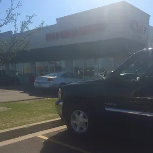 a car parked in front of a restaurant