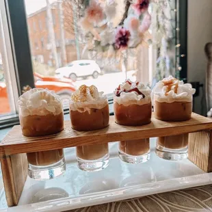 four desserts on a serving tray