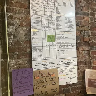 a menu on a brick wall