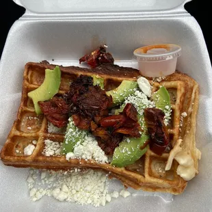 Waffle with goat cheese avocado and sun dried tomatoes