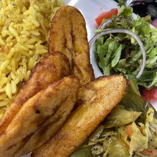 Plantains, yellow rice, veggies and salad