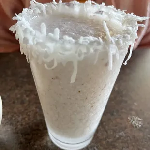 a glass of coconut milkshake