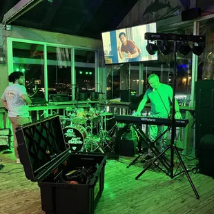 a band playing on stage at night
