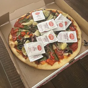The waitress just threw all the packets over the pizza.