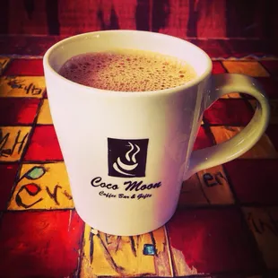 a cup of coffee on a table