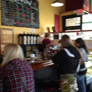 a group of people standing at a counter
