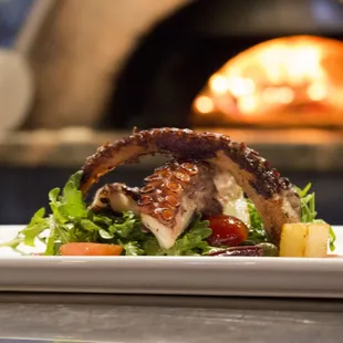 a plate of food in front of an oven