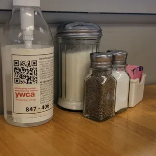 Table condiments that include hand sanitizer