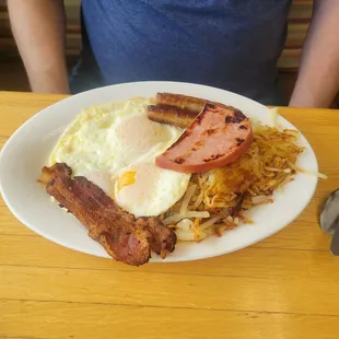 Can&apos;t remember what this is called but it&apos;s the big breakfast. 3 over easy eggs, a slice of ham. 2 bacon. 2 sausage, hashbrowns and toast.