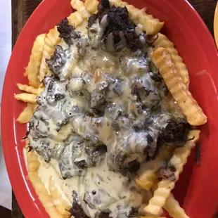 French fries with barbocola beef and it&apos;s served as a meal