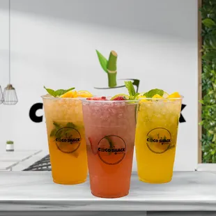 three different drinks on a counter