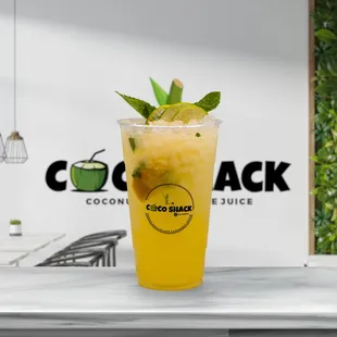 a drink in a tall glass on a counter